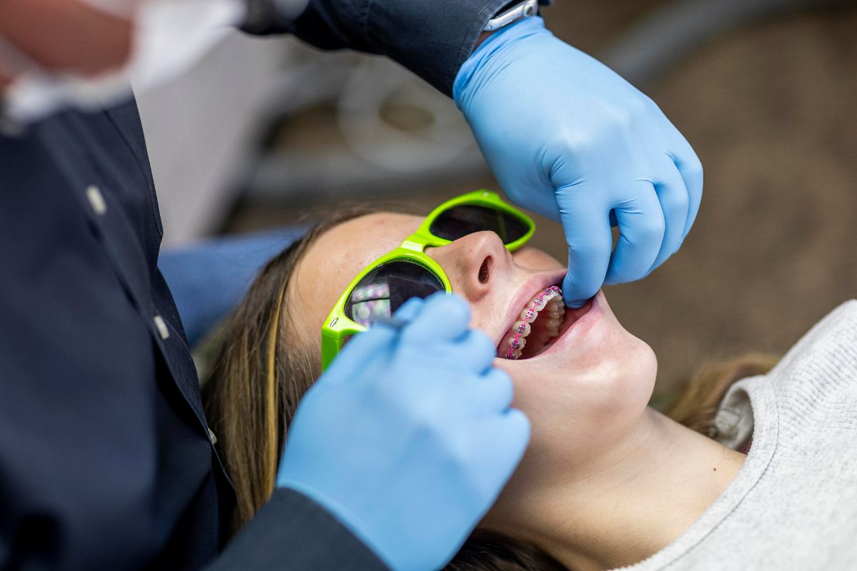 early-orthodontic-treatment-near-me Child receiving early orthodontic treatment with braces at Kohrs Orthodontics in Aurora, Bennett, and Strasburg, CO, providing expert, top-rated pediatric orthodontic care