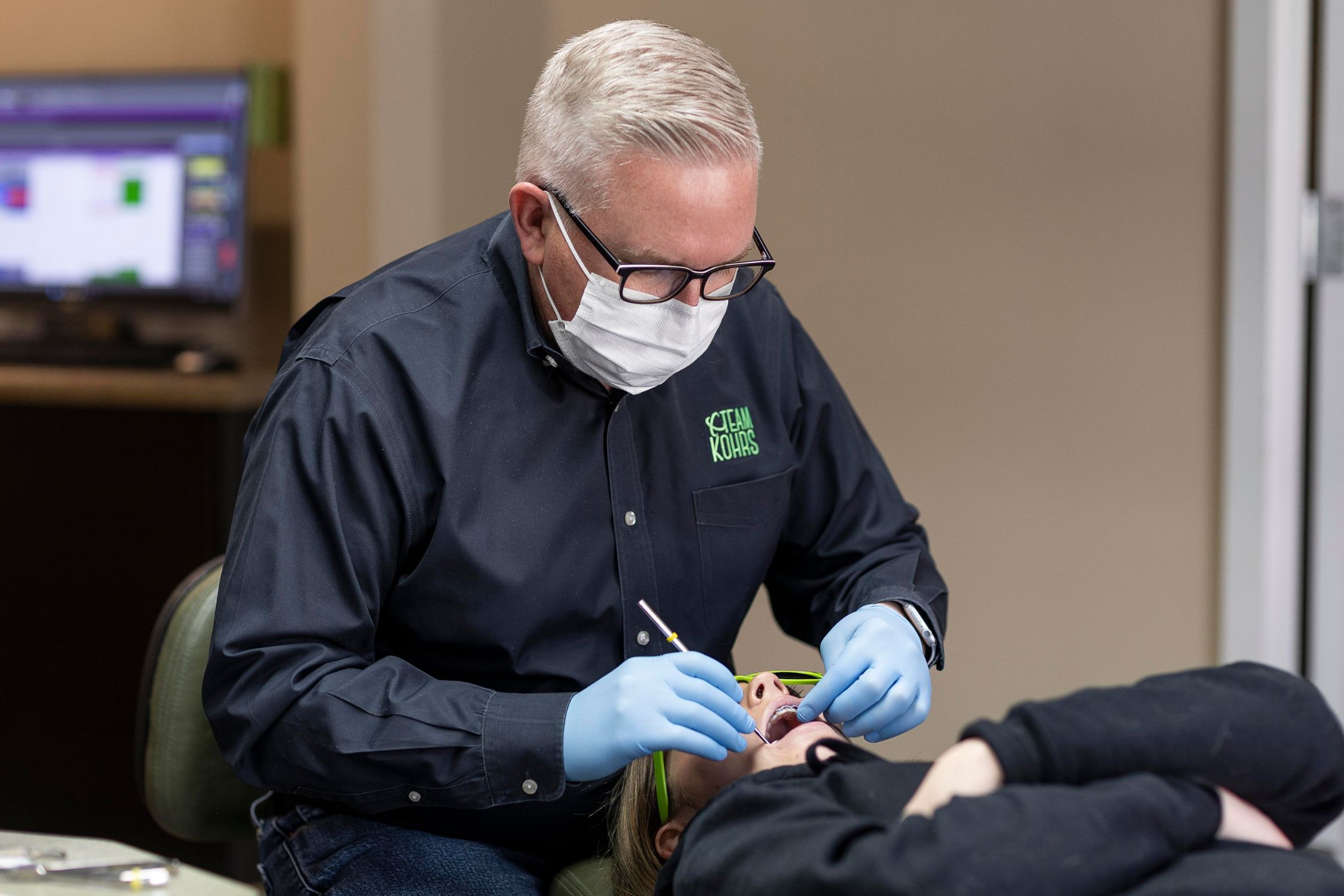 Dr. Kohrs providing expert orthodontic treatment to a patient at Kohrs Orthodontics Aurora West in Colorado