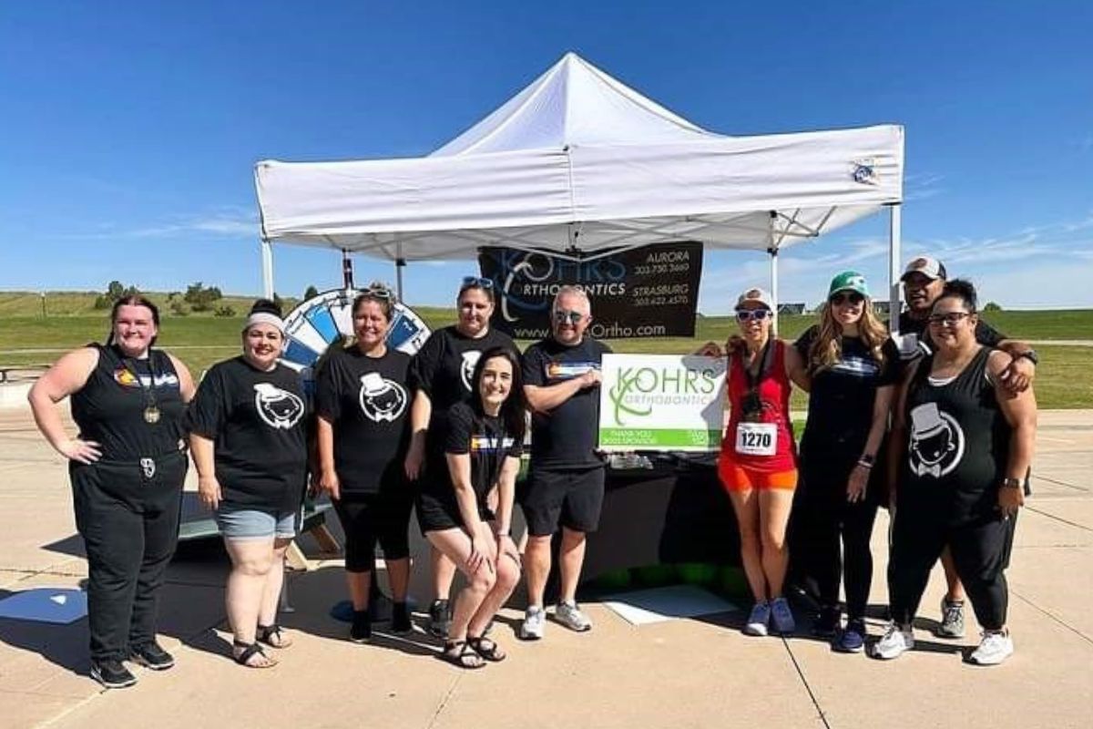 Kohrs Orthodontics team at a community event in Aurora, Bennett, and Strasburg, CO, representing a top-rated orthodontic practice and inviting applicants to join our team