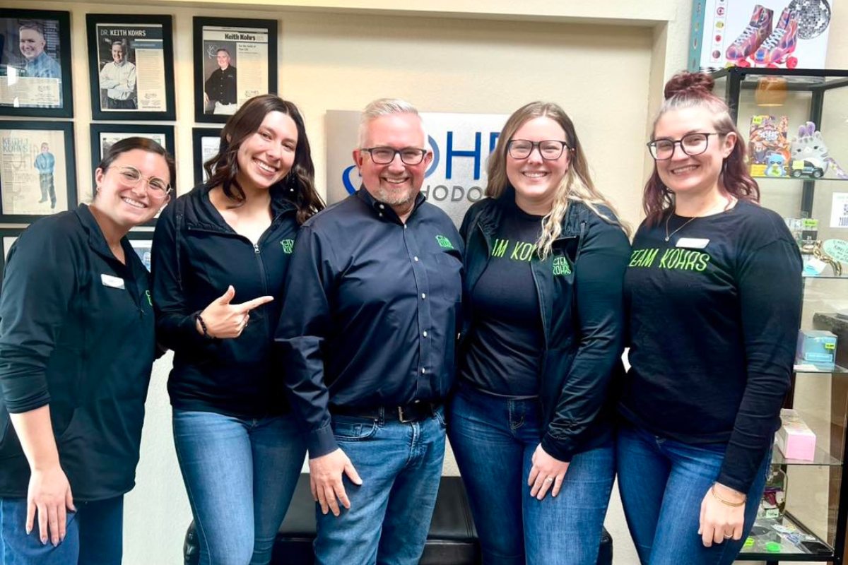 Kohrs Orthodontics Heather Ridge team posing in office, representing expert orthodontic care and positive team culture in Colorado