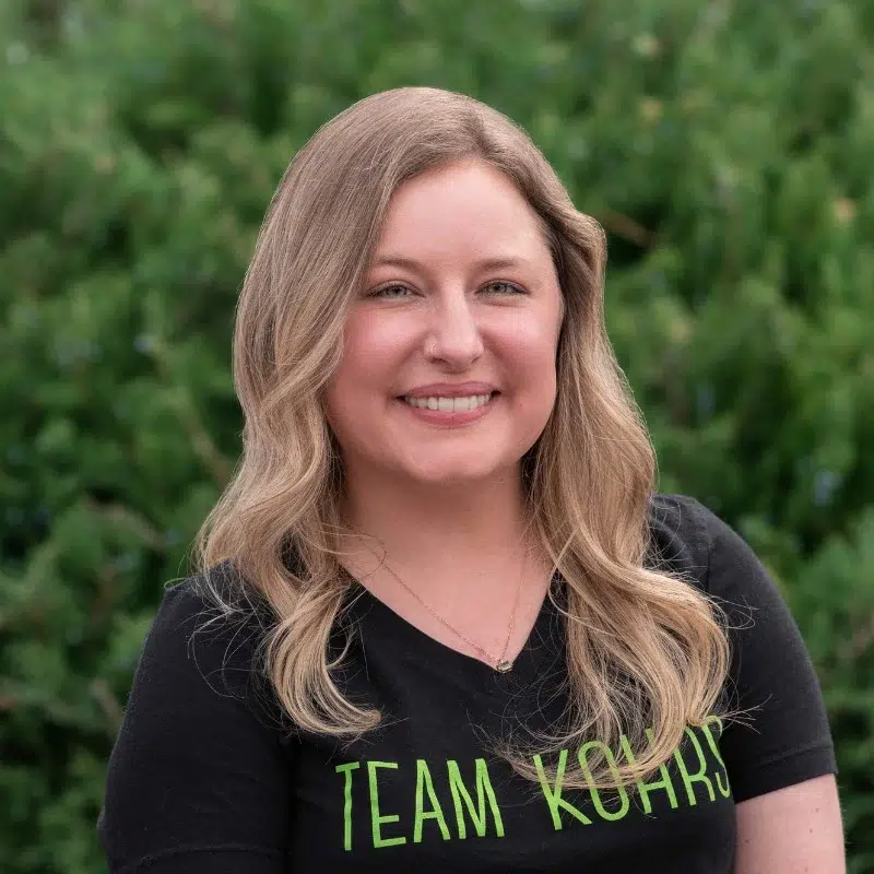Hayley scheduling coordinator at kohrs orthodontics smiling in professional team headshot outdoors