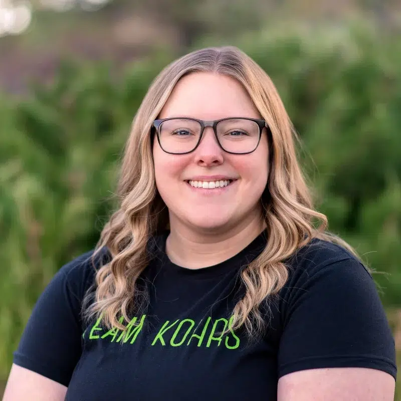 Jessica from kohrs orthodontics smiling in outdoor professional headshot for orthodontic office team