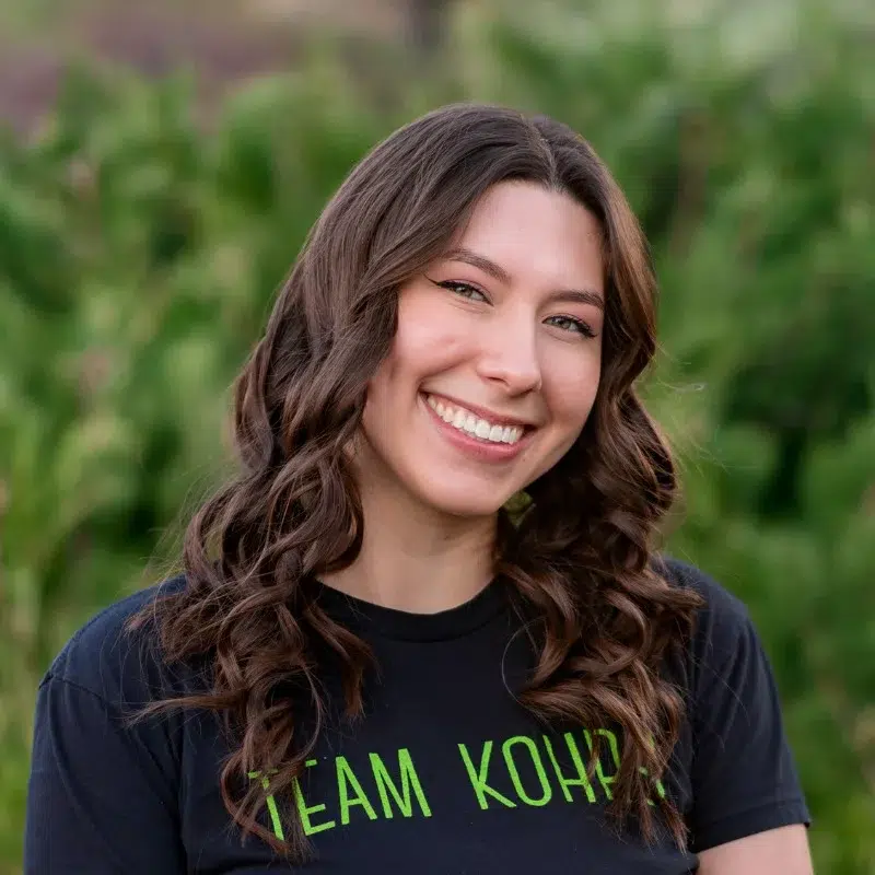 Kylie from kohrs orthodontics smiling in professional outdoor headshot for orthodontic team