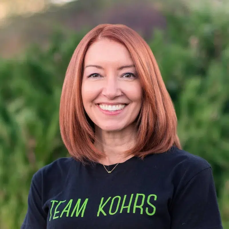 Melissa at kohrs orthodontics smiling in outdoor team photo representing orthodontic patient care team