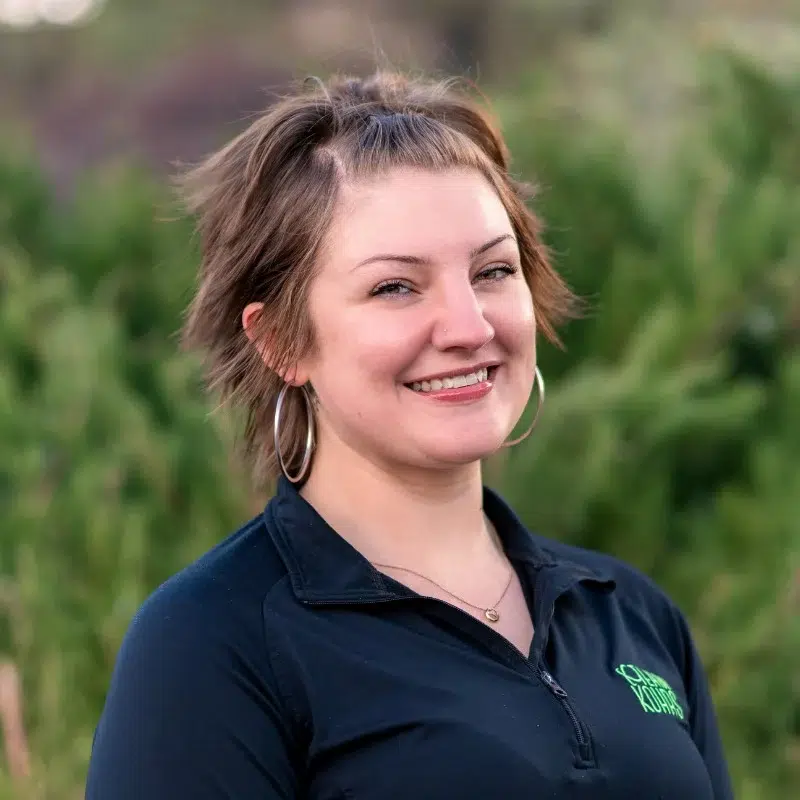 Kohrs-orthodontics-team-headshots-sarah-scheduling-coordinator Sarah from kohrs orthodontics smiling in outdoor team headshot representing experienced orthodontic staff
