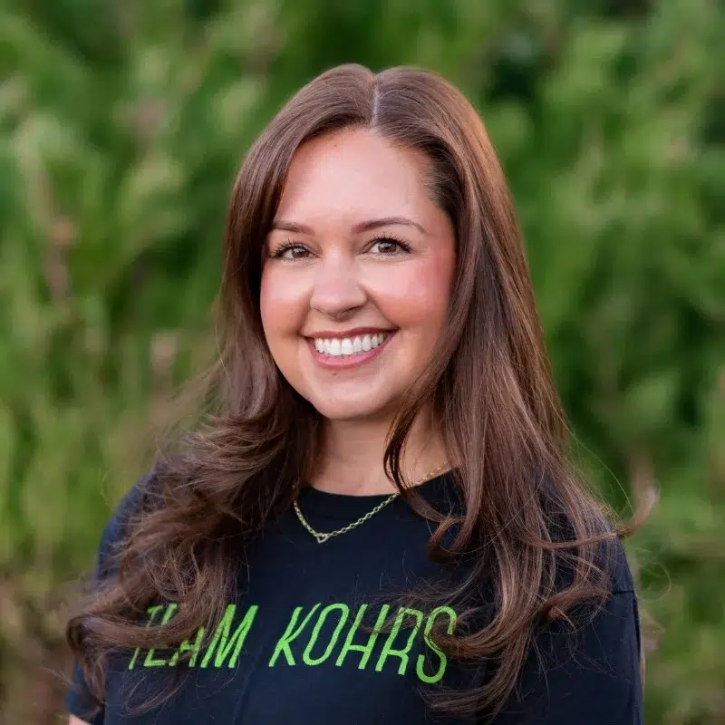 Tiffany at kohrs orthodontics smiling outdoors in professional team photo providing orthodontic care