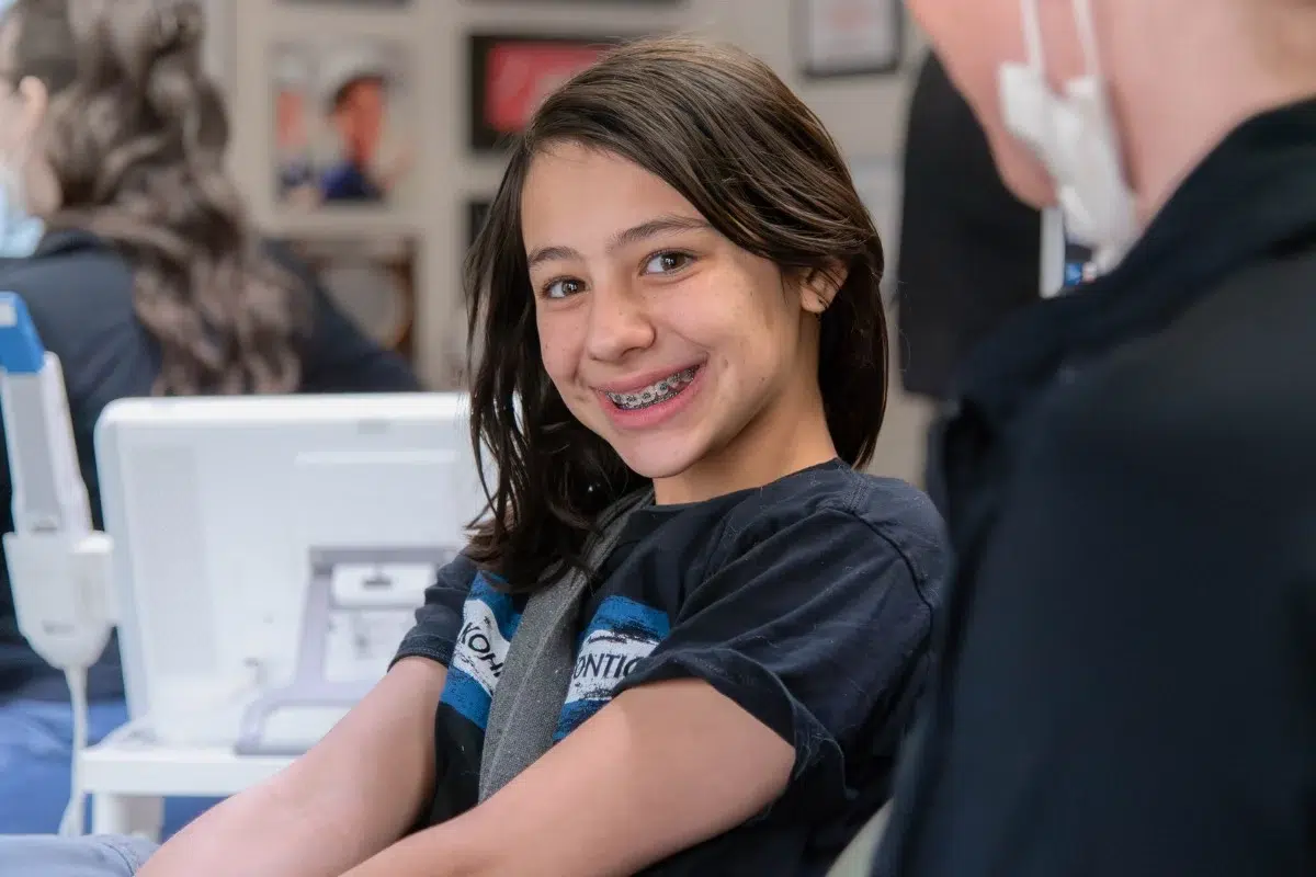 Kohrs-orthodontics-braces-patient Smiling braces patient at kohrs orthodontics in aurora, bennett, and strasburg, co, receiving expert clear braces orthodontic treatment from a top-rated metro denver orthodontist