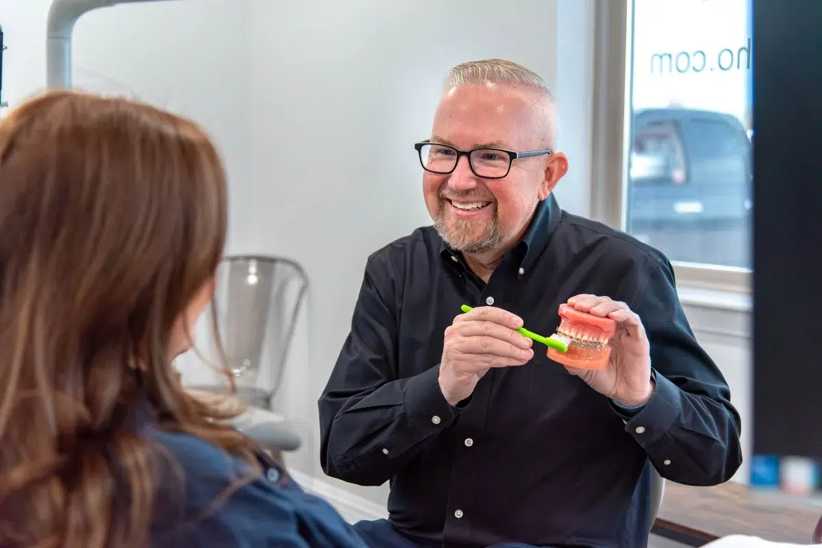 Kohrs-orthodontics-dr-kohrs-in-bennett Expert orthodontist explaining clear braces treatment at kohrs orthodontics in bennett, aurora, and strasburg, co, offering top-rated metro denver orthodontic care