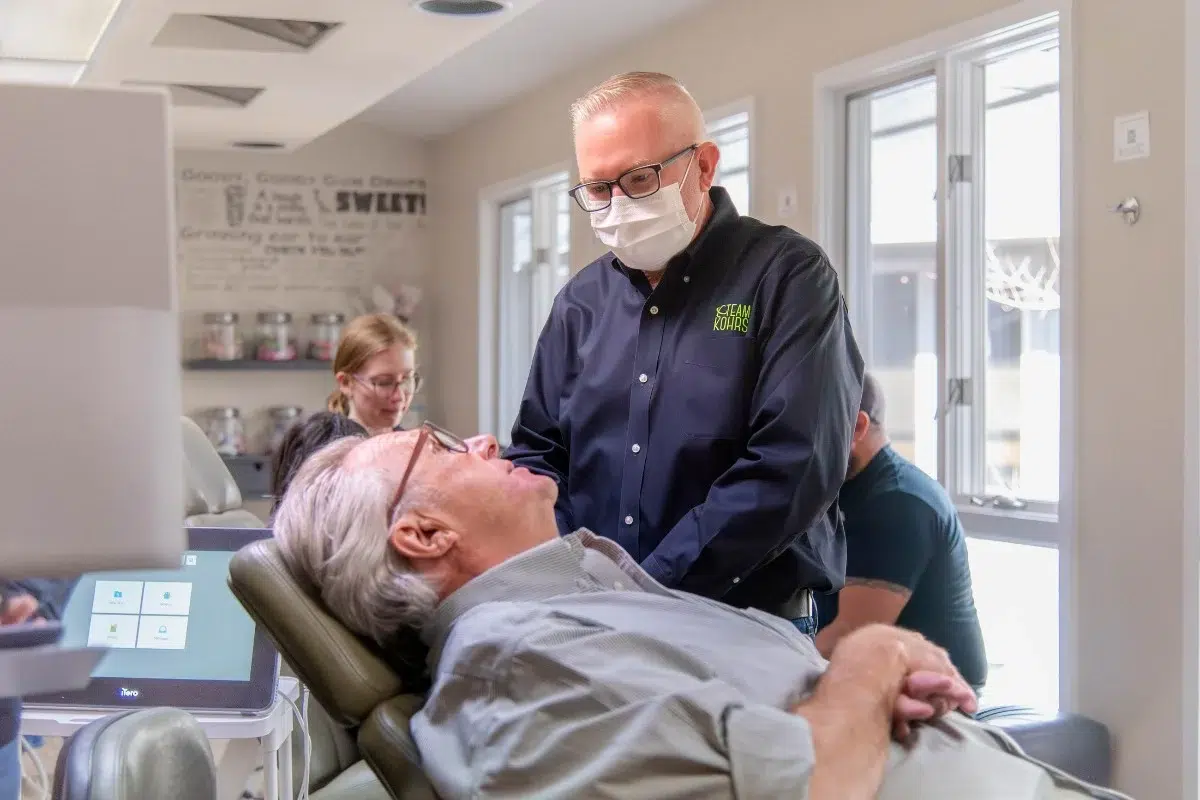 Kohrs-orthodontics-meadow-hills Adult patient receiving expert braces and clear braces consultation at kohrs orthodontics in aurora, bennett, and strasburg, co, with top-rated orthodontic care near meadow hills